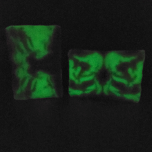 Load image into Gallery viewer, Celebration Artisan Soap glowing in the dark