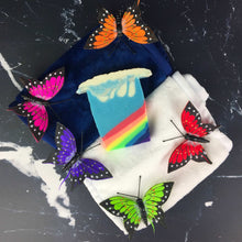 Load image into Gallery viewer, Ocean Rainbow Artisan Soap with butterflies on blue and white towels